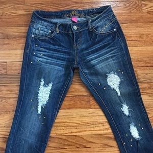 Distressed jeans with gold sequins